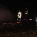 hay fire firemen on trailer dark