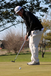 Brady Aunspach watches as his putt just misses to the right of the cup on the fifth green.