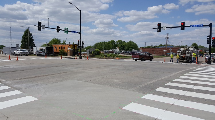 The intersection of Willis and First avenues in Perry is taking on a new look with freshly painted crosswalks, pedestrian-friendly stop lights and center turn lanes for motorists. The corner is expected to be open for full use Monday.