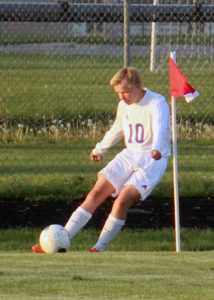 Chance Webster sends a corner kick toward the ADM goal during Perry's 2-0 win at Dewey Field Tuesday.