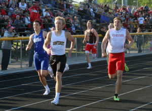 Perry's Adan Medina (left) secured a spot in the state meet after his second place finish in the 400 meter dash.