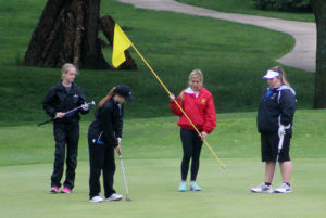 Perry's Ellie Nielsen rolled in this short putt on the second hole as her playing partners watched during the RRC meet at the Perry Golf and Country Club Monday.