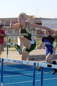 Savannah David flies over the final hurdle on the second leg of the shuttle relay.