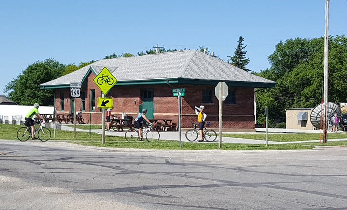 Many trekkers on the Raccoon River valley Trail still stop to rest at the now-vacant Minburn Depot. Most seekers of refreshment pedal on to Perry or Dallas Center. The city seeks a tenant for the recently removed and restored 100-year-old depot, former stop on the Interurban Railroad.
