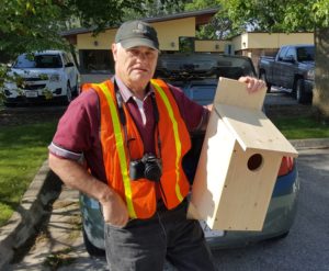 ThePerryNews.com Naturalist Ray Harden holds a kestrel box produced by students in the Perry Middle School shop class.