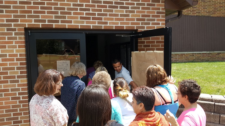 Eager shoppers listened more or less patiently when new St. Patrick School Principal Eddie Diaz opened the doors and introduced himself at the start of the summer rummage sale Thursday at St. Pat's gym. The sale continues Friday and Saturday.
