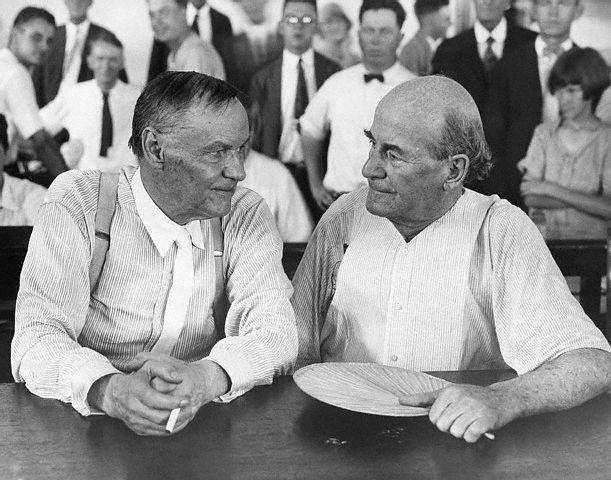Clarence Darrow, left, a famous Chicago prosecutor, and William Jennings Bryan, defender of Biblical fundamentalism, chatted pleasantly in the courtroom during the Scopes evolution trial.