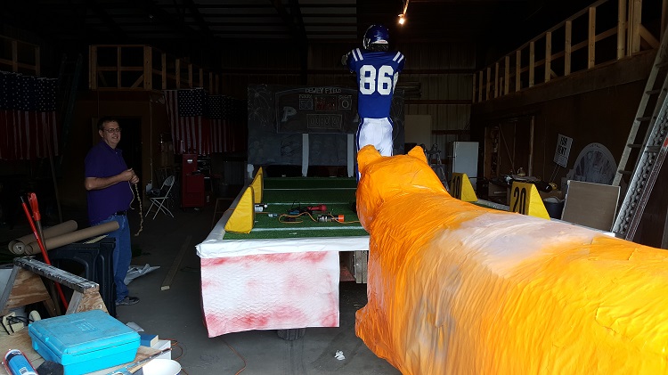 An orange Gilbert High School tiger will be one notable element of the Perry-Area Chamber of Commerce float celebrating the return of the PHS Homecoming Parade. A Bluejay gridiron figure will probably be pulling the tiger's tail with a score of 50-0.