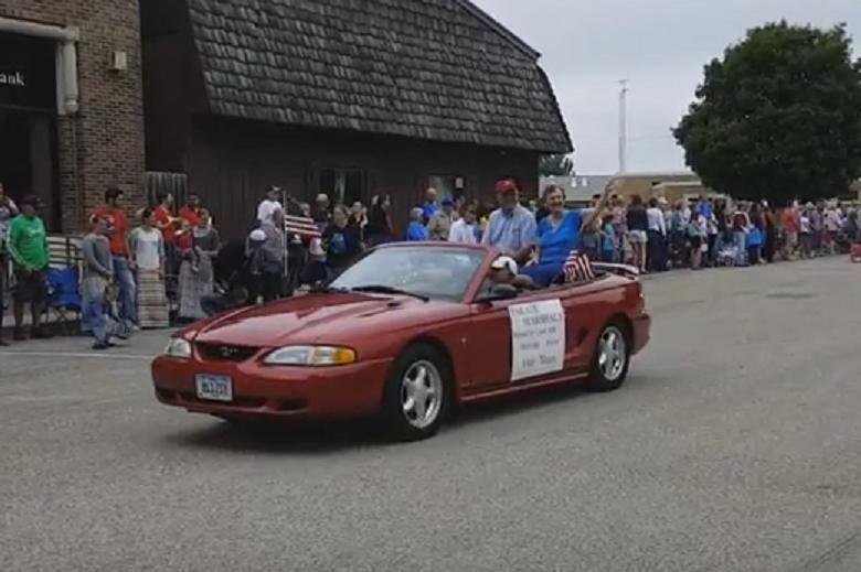 Minburn Fourth of July Parade Marshalls Harold and Carol Hill led the way in the 2016 event Monday morning. The Hills live on a 150-year-old Heritage Farm near Minburn.