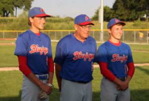 Alex Long (left) stands with his grandfather, Perry skipper Mike Long, and with his fellow senior Kade Van Kirk after the two were honored before the final home game of their prep career Wednesday.