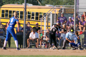 Perry's Emma Olejniczak blew this pitch past Norwalk's Briley Sodergren for a strikeout in the second inning Saturday. Brooke Huntington catches for the Jayettes.