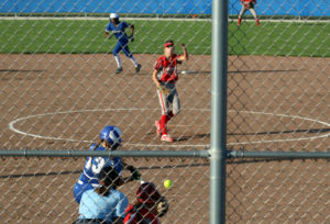 Rachel Kinney puts the ball in play as Jo Diw steps off second base in the first inning.