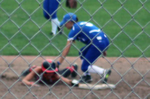 Sid Vancil tags out Carleigh Paup, who slid past second base after being initially ruled safe on her steal attempt.