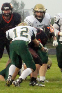John Stucker makes a tackle for the Hawks.