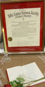 The original charter with a rose on Wilma's name in the initiate book,