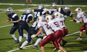 Noah Ramsey (74) and Justin Rolfes (63) pull as Luke South turns to hand the ball off for Panorama during last Friday's game with South Hamilton. Photo courtesy Debra Grunsted.
