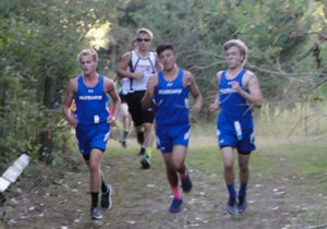 From left: Dane McCarty, Mario Cruz and Zach Stewart run in the Greene County Invite Thurday. Photo courtesy Mark McCarty.