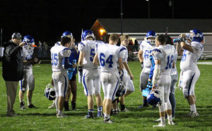 Bluejay players take a water break during a stoppage of play in the second half.