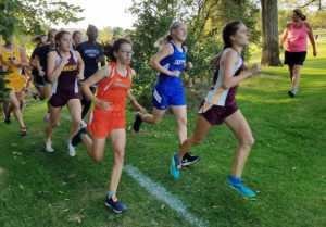 Perry's Grace Stewart runs in a pack during Tuesday's Cardinal Invitational in Newton. Photo courtesy Shaylena Bell.