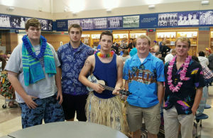 Perry seniors, from left, Dax Kreese, Kyle Nevitt, Malachi Meri, Grant Eklund and Dane McCarty dress the part for "Tropical Tuesday" at Perry High School, part of the week-long celebration of Homecoming.