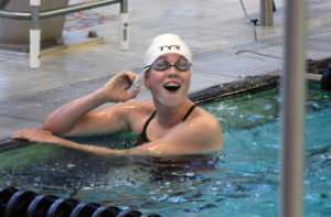 Breanna Penenger has reason to smile after winning the 500 freestyle -- she dropped several seconds off her previous personal best in the event. Photo courtesy Jim Dowd.