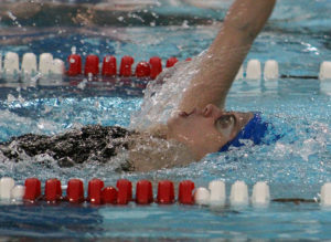 Senior Haley Vaughn nears the finish of the 100 backstroke Tuesday.
