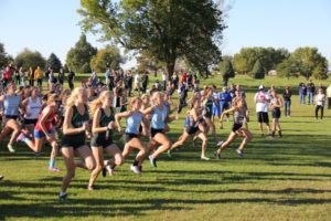 A mad sprint ensues at the start of every cross country meet as runners race to grab position, as in the start of Thursday's WCV Invite at the 5x80 Golf Course in Menlo. Photo courtesy Eileen Nordquist.