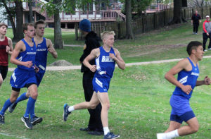 Perry's Alexis Macias leads teammates Zach Thompson, Dane McCarty and Zach Stewart in the early stages of the boys varsity race in the RRC meet Monday at the Perry Golf and Country Club.