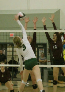 W-G's Julie Pitman attacks the Grundy Center front wall.