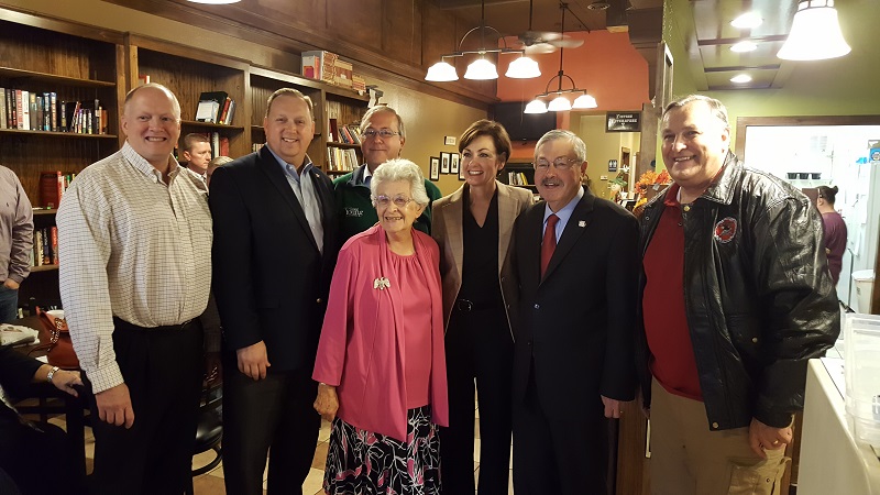 Barbara Grassley, in pink, wife of U.S. Sen. Chuck Grassley, was joined by Iowa politicians, from left, Dallas County Treasurer Mitch Hambleton, Dallas County Recorder Chad Airhart, U.S. Rep. David Young, Iowa Lt. Gov. Kim Reynolds, Iowa Gov. Terry Branstad and Rep. Ralph Watts in Adel Tuesday morning for coffee and muffins in support of Youngs reelection bid.
