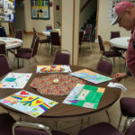 lions-lou-and-posters-on-tables