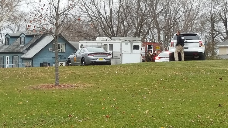 The Iowa State Patrol and the Dallas County Sheriff's offices extricated two people from the blue house at 111 S. Jefferson St. in Bouton about 3:30 p.m. Friday.