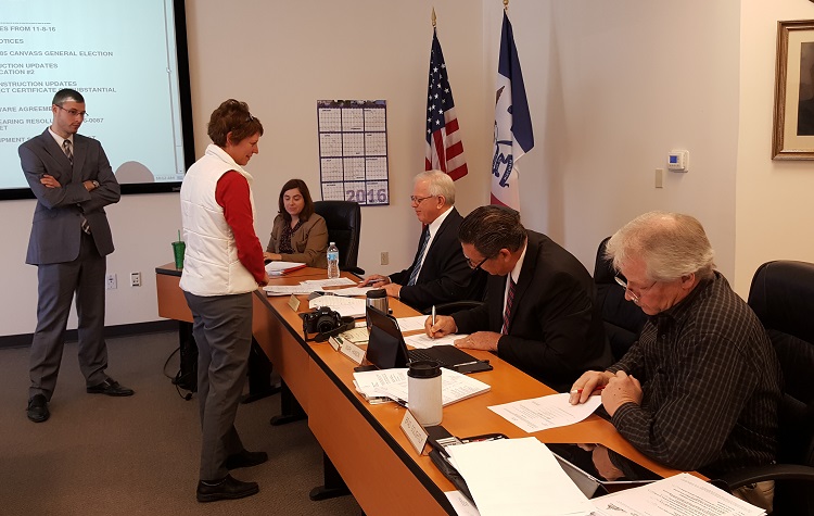Dallas County Absentee Assistant Lance Kramer, Dallas County Deputy of Elections Kim Owens, Dallas County Deputy Auditor Julia Helm and Dallas County Supervisors Kim Chapman, Mark Hanson and Brad Golightly.