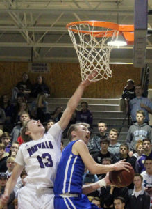 Drew Levan tries for a reverse layup against the defense of Bowen Born.