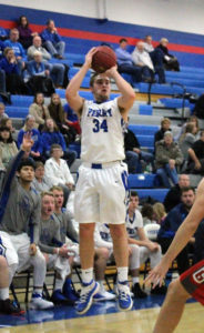 Bluejay reserve Mark Campos signals what is coming as Kyle Nevitt fires away in the fourth quarter against the Mustangs Tuesday.