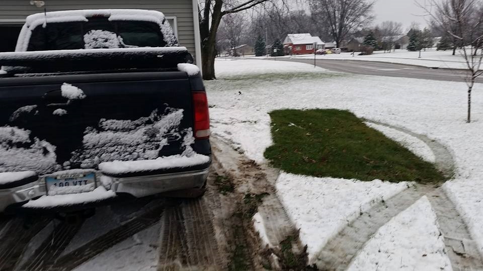 "Where truck sits now is legal. Where grass is with no snow is not," said the unhappy property owner who found Sunday morning he received a $15 parking ticket.