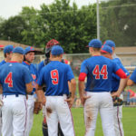 pry base in front of dugout